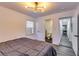 Relaxing bedroom with a view to an en suite bathroom, showcasing a peaceful retreat with convenient amenities at 2876 Randall St, East Point, GA 30344