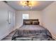 Bright bedroom featuring modern lighting, a comfortable bed, and ample space, ideal for relaxation and rest at 2876 Randall St, East Point, GA 30344