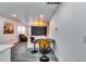 Cozy kitchen bar area with modern stools, a sleek countertop, and an open concept design at 2876 Randall St, East Point, GA 30344