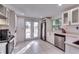 Modern kitchen with white cabinets, stainless steel appliances, and bright natural light at 2876 Randall St, East Point, GA 30344