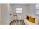 Bright room featuring a chair, window, and comfortable seating, complemented by modern flooring and neutral decor at 2876 Randall St, East Point, GA 30344