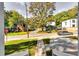 Street with sidewalk featuring mature trees, a stop sign, and neighborhood charm at 2876 Randall St, East Point, GA 30344