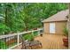 Elevated deck with a comfortable lounge chair and lush greenery, perfect for relaxation and enjoying nature's beauty at 3902 Butterstream Way, Kennesaw, GA 30144