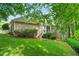 Spacious backyard with lush lawn, landscaping, and stairs to deck at 3902 Butterstream Way, Kennesaw, GA 30144