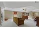 Finished basement area with plush carpeting, built-in shelving, and comfortable furniture at 3902 Butterstream Way, Kennesaw, GA 30144