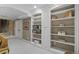 Basement with built-in shelves and multiple doorways creates an open feel at 3902 Butterstream Way, Kennesaw, GA 30144