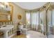 Well-lit bathroom showcasing a pedestal sink, decorative mirrors, and a shower with glass doors at 3902 Butterstream Way, Kennesaw, GA 30144