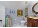 Charming bathroom features a decorative vanity, blue accents, and unique wall art at 3902 Butterstream Way, Kennesaw, GA 30144