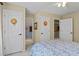 Bedroom showcasing three entryways, each with decor, and natural light enhancing the neutral walls at 3902 Butterstream Way, Kennesaw, GA 30144