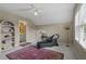 Bedroom with sitting area and en suite bathroom featuring an ornate rug and decor at 3902 Butterstream Way, Kennesaw, GA 30144