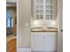 Butler's pantry with white cabinets, tiled backsplash, and wood countertop at 3902 Butterstream Way, Kennesaw, GA 30144