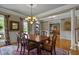 Traditional dining room featuring hardwood floors, a large window and view to living space at 3902 Butterstream Way, Kennesaw, GA 30144