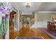 Elegant foyer with hardwood floors, decorative columns, and a view of the staircase, creating a grand entrance at 3902 Butterstream Way, Kennesaw, GA 30144