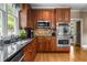 Kitchen featuring granite countertops, stainless steel appliances and stone backsplash at 3902 Butterstream Way, Kennesaw, GA 30144