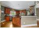 Spacious kitchen featuring wooden cabinets, granite countertops, and a breakfast bar at 3902 Butterstream Way, Kennesaw, GA 30144