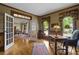 Bright living space boasts hardwood floors, trim detail, and an open concept feel with a view to dining area at 3902 Butterstream Way, Kennesaw, GA 30144