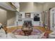 Elegant living room with fireplace, built-ins, and large windows, offering a bright and inviting atmosphere at 3902 Butterstream Way, Kennesaw, GA 30144