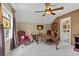 Bright home office with a ceiling fan, stained glass window, and a custom desk at 3902 Butterstream Way, Kennesaw, GA 30144