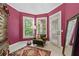 Bright sitting room with a comfortable chair, a rug, and a view of the yard at 3902 Butterstream Way, Kennesaw, GA 30144