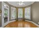 Sun-filled room featuring floor-to-ceiling windows, hardwood floors, and a light-filled space to enjoy the view at 3902 Butterstream Way, Kennesaw, GA 30144