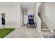Finished basement featuring a mini golf and basketball game area, stairs and two white doors at 803 Baugh Springs Ln, Lawrenceville, GA 30044