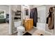 Bathroom features a tile floor, mirror, and a shower with a patterned curtain at 803 Baugh Springs Ln, Lawrenceville, GA 30044