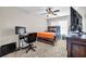 Bedroom features a ceiling fan, carpet flooring, and natural light, with space for a bed and desk at 803 Baugh Springs Ln, Lawrenceville, GA 30044