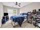 Bedroom features include carpet, ceiling fan, large window, and a large amount of shoes at 803 Baugh Springs Ln, Lawrenceville, GA 30044