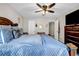 Comfortable bedroom with a ceiling fan, carpet floors, and natural light offers a relaxing retreat at 803 Baugh Springs Ln, Lawrenceville, GA 30044