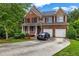Two-story home with brick and siding, attached garage, and landscaped front yard offers great curb appeal at 803 Baugh Springs Ln, Lawrenceville, GA 30044