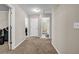 Hallway features include neutral walls and carpet, and doors leading to various rooms at 803 Baugh Springs Ln, Lawrenceville, GA 30044