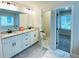 Bright bathroom features a double vanity with granite counters and an adjacent water closet at 1540 Ox Bridge Ct, Lawrenceville, GA 30043