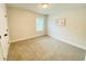 Neutrally decorated bedroom with plush carpet, light walls, and natural light at 1540 Ox Bridge Ct, Lawrenceville, GA 30043