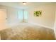 Bright bedroom with a neutral color palette, carpeted flooring, and two windows at 1540 Ox Bridge Ct, Lawrenceville, GA 30043