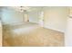 Large carpeted primary bedroom with neutral walls and access to en-suite bathroom at 1540 Ox Bridge Ct, Lawrenceville, GA 30043