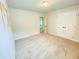 Neutrally decorated bedroom with plush carpet, light walls, a simple light fixture and walk-in closet at 1540 Ox Bridge Ct, Lawrenceville, GA 30043