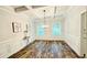 Dining room featuring a coffered ceiling, wainscotting, and hardwood floors at 1540 Ox Bridge Ct, Lawrenceville, GA 30043