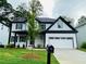 Beautiful two-story home featuring a manicured lawn and a convenient two-car garage at 1540 Ox Bridge Ct, Lawrenceville, GA 30043