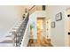 Bright foyer features hardwood floors and a staircase with decorative iron railings at 1540 Ox Bridge Ct, Lawrenceville, GA 30043