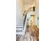 Bright foyer features hardwood floors and a staircase with decorative iron railings at 1540 Ox Bridge Ct, Lawrenceville, GA 30043
