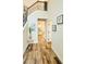 Bright foyer features hardwood floors and a staircase with decorative iron railings at 1540 Ox Bridge Ct, Lawrenceville, GA 30043
