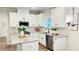 Well-lit kitchen features stainless steel appliances and island at 1540 Ox Bridge Ct, Lawrenceville, GA 30043