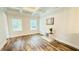 Living room with tray ceiling, hardwood floors, and natural light at 1540 Ox Bridge Ct, Lawrenceville, GA 30043