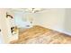 Open living room featuring modern ceiling fan and brick fireplace at 1540 Ox Bridge Ct, Lawrenceville, GA 30043