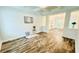 Spacious living room with tray ceiling, hardwood floors, and decorative columns at 1540 Ox Bridge Ct, Lawrenceville, GA 30043