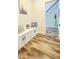 Mudroom featuring storage, seating and view into the staircase at 1540 Ox Bridge Ct, Lawrenceville, GA 30043