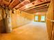 Large unfinished basement featuring open ceiling with insulation and rough-in plumbing at 1540 Ox Bridge Ct, Lawrenceville, GA 30043