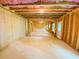 Spacious unfinished basement with framing and windows for natural light at 1540 Ox Bridge Ct, Lawrenceville, GA 30043