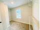 Spacious walk-in closet with carpeted floor, window, and built in shelving at 1540 Ox Bridge Ct, Lawrenceville, GA 30043