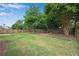 Beautiful backyard with lush green grass, mature shade trees and a wooden perimeter fence at 1712 Bonnabel Ne Trce, Marietta, GA 30066